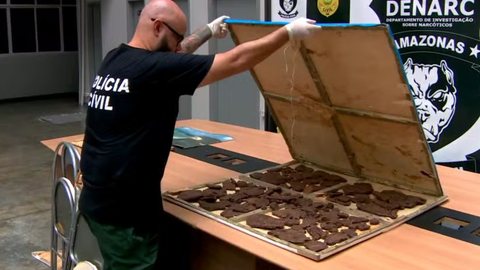 Investigadores encontraram cocaína negra, uma substância nova no Brasil, escondida em móveis de uma mansão em Manaus - Imagem: Reprodução/Tv Globo