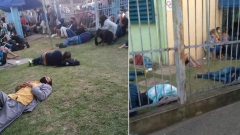 Pacientes aguardam atendimento deitados em gramado de Unidade de Pronto Atendimento em Guarulhos, na Grande SP