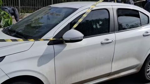 O motorista foi atingido por quatro disparos, mas ainda não há informações sobre seu estado de saúde após o atendimento médico - Imagem: Reprodução/TV Globo