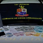 Notas falsas, dinheiro em espécie e produtos adquiridos por meio de golpes foram apreendidos - Imagem: Divulgação | PMSP