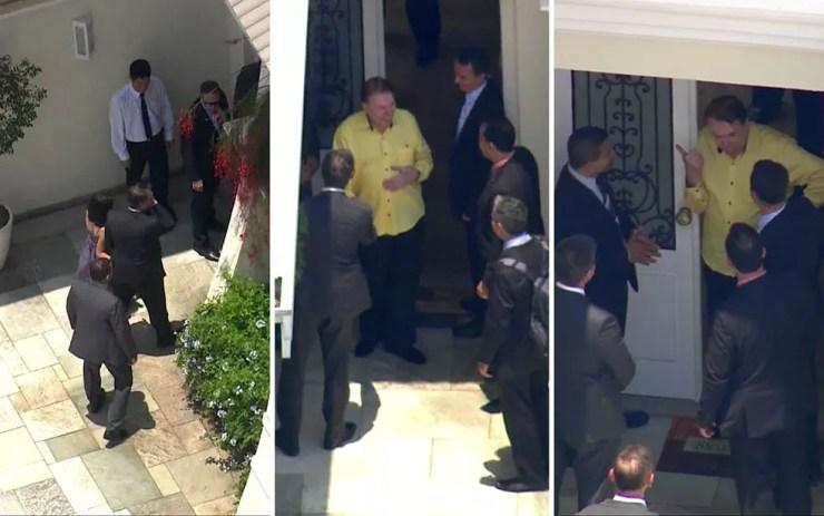 Jair Bolsonaro chega à casa de Silvio Santos (à esquerda); empresário sai à porta e conversa com outras pessoas da comitiva — Foto: TV Globo/Reprodução