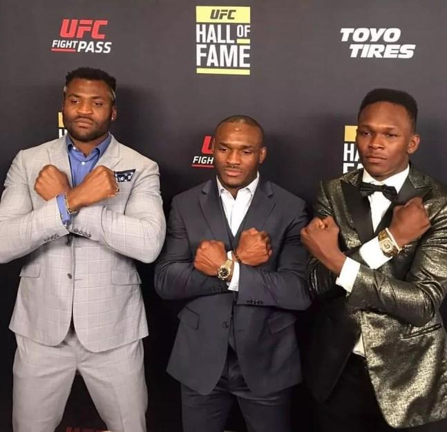 Francis Ngannou, Kamaru Usman e Israel Adesanya são os três campeões africanos do UFC — Foto: Divulgação / UFC
