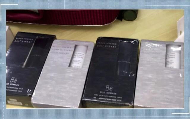 Pistolas escondidas em embalagens de perfume em Congonhas — Foto: Reprodução/TV Globo