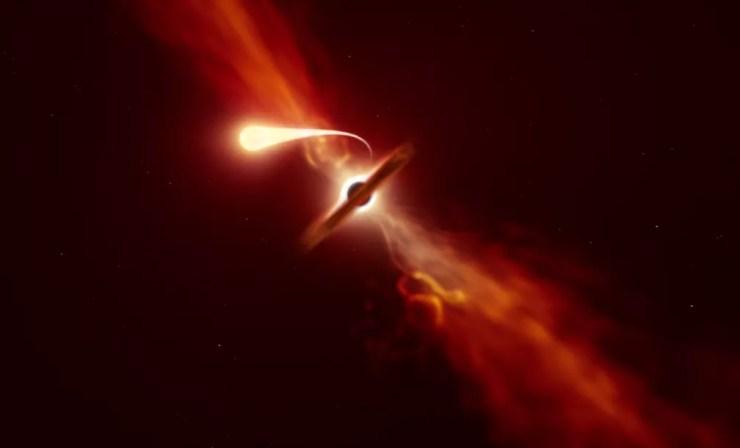 Concepção artística mostra uma estrela sendo devorada por um buraco negro.  — Foto: ESO/M. Kornmesse 